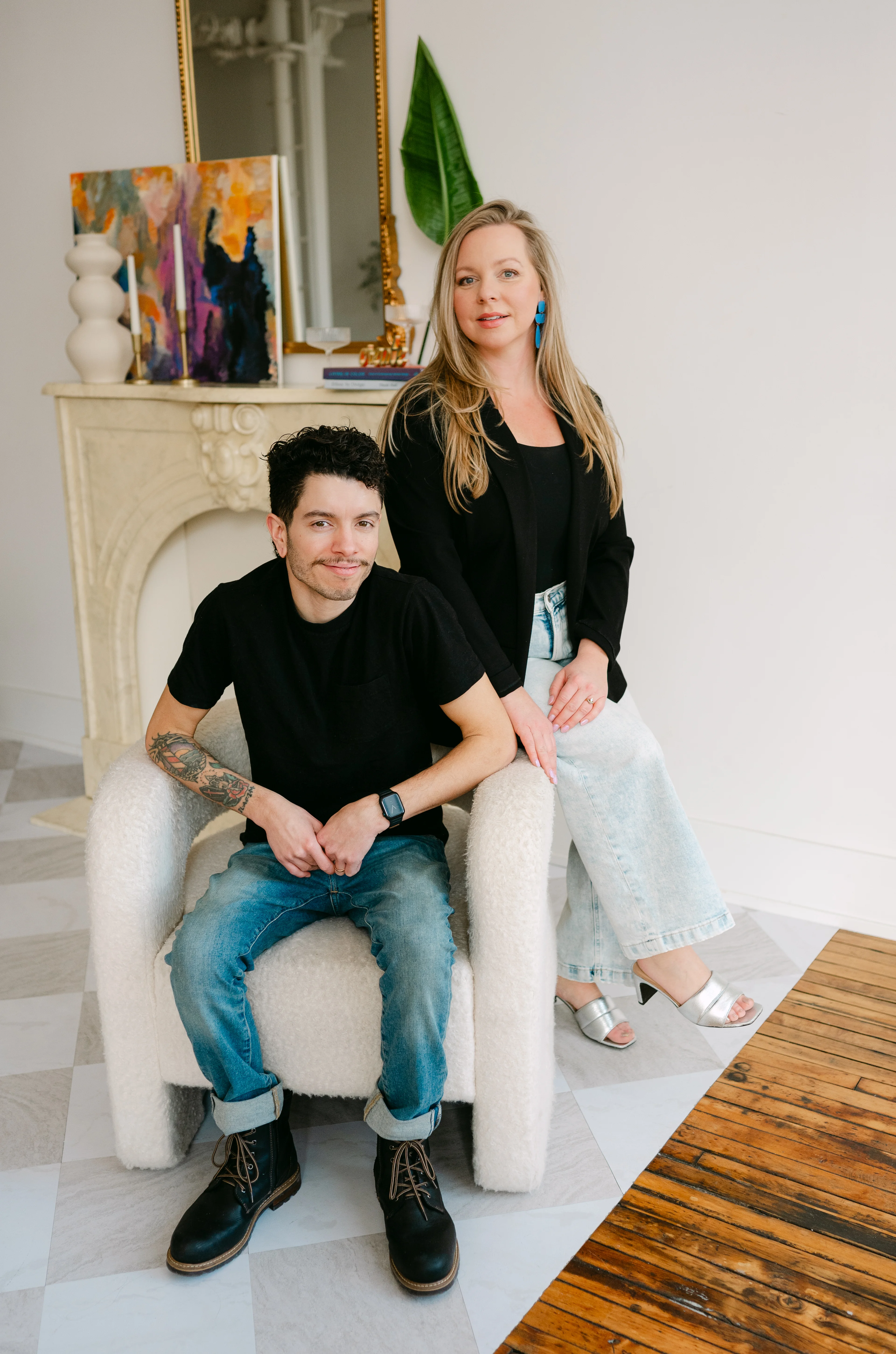 Keith and Julianna Perez, side by side against a white wall